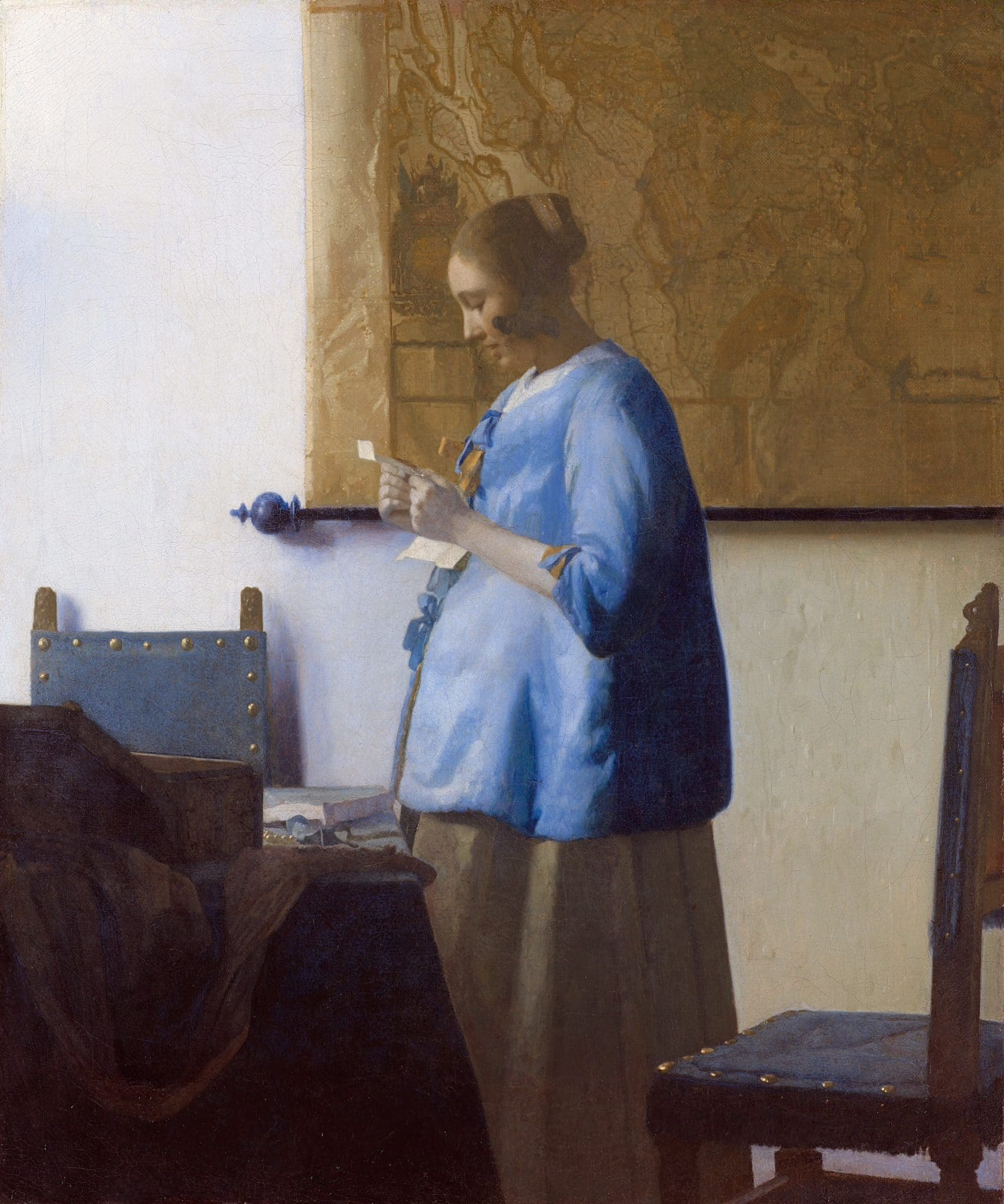 Johannes vermeer, donna in blu che legge una lettera